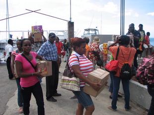 Image #27 - Hurricane Tomas Relief Effort (Carrying the goods to the distribution point)